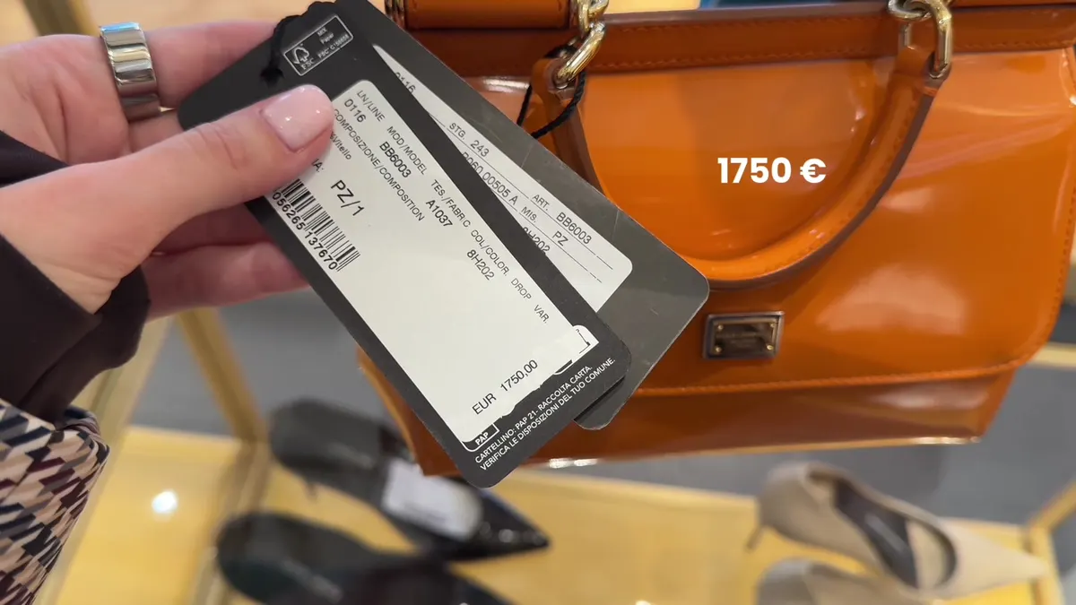 Orange Dolce & Gabbana bag with a BB6003 label showing €1,750.