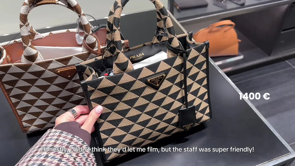 Black and tan geometric-pattern Prada handbag with an on-screen price of €1,400.