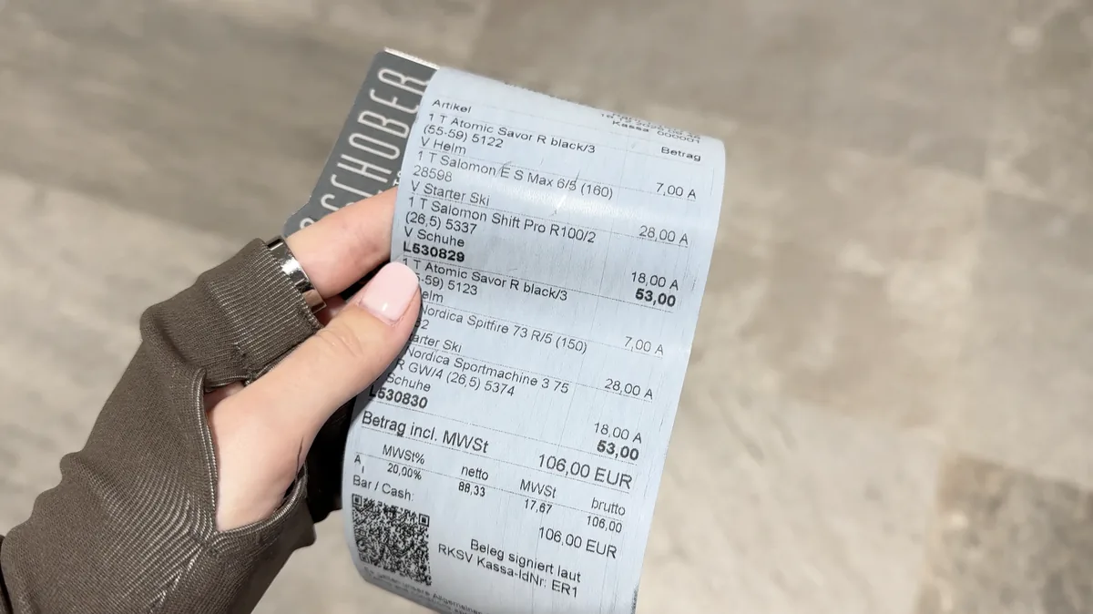 A Schober receipt with two sets of skis, boots and helmets, each costing 53 euros and totalling 106 euros.